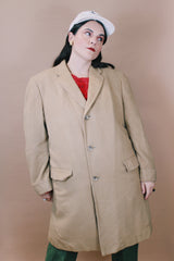 Men's or women's vintage 1960's Cashmere Deluxe Exclusively For Baskin label size large long sleeve long length tan camel colored cashmere coat with button closure.