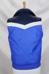 Women's or men's vintage 1970's Sears, Boys label sleeveless puffy vest in white, navy, and blue. Side pockets and zipper up the front.