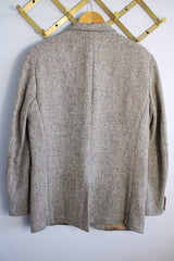 Men's or women's vintage 1960's Nordstrom, Harris Tweed, Tailored in the USA label long sleeve grey colored wool blazer with front pockets and partial lining.