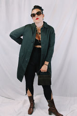Men's or women's vintage 1960's Brent Prep Sold Exclusively by Montgomery Ward long sleeve long length cotton material lightweight trench coat in a dark green and all over subtle plaid print.