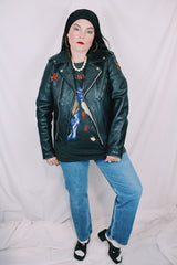 Men's or women's vintage 1970's Harley-Davidson label long sleeve black leather motorcycle jacket with silver hardware and patches.