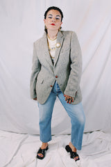 Men's or women's vintage 1960's Nordstrom, Harris Tweed, Tailored in the USA label long sleeve grey colored wool blazer with front pockets and partial lining.