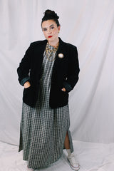 Women's vintage 1970's The Chaus Woman label long sleeve black velvet blazer in a cotton and rayon blend material. One button closure, two pockets, and fully lined.