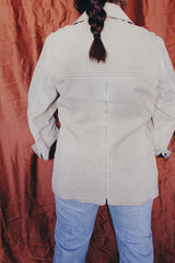 Women's or men's vintage 1970's Styled by William Barry label long sleeve grey colored suede jacket with maroon colored liner and popper buttons.