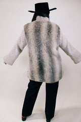 Women's vintage 1980's Lifestyle 80's by Andrea Ungar label long sleeve jacket with faux fur body in front and back and acrylic arms. Buttons up the front with side pockets.