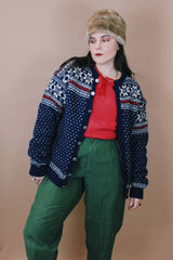 Women's or men's vintage 1970's Norway Handknitted label size large navy blue Norwegian style button up wool cardigan with all over white and red print