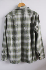 Men's vintage 1960's Pendleton size medium long sleeve button up wool shirt in all over green and white plaid print. Two chest pockets.