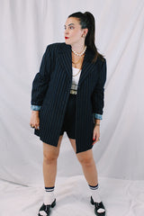 Men's or women's vintage 1970's University Seal Authentic Fashion label long sleeve navy blue wool blazer with all over pin stripes. Has pockets, textured buttons, and a back slit.