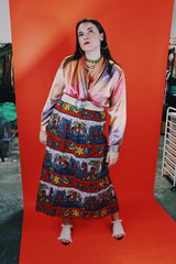 Women's vintage 1980's Impressions of California, Made in USA label long sleeve slinky silk like blouse with double breasted closure in orange, purple, and pink.