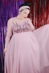 Women's vintage 1980's long sleeve long length pink maxi dress. Has sheer sleeves and sequins across the chest