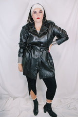 Women's vintage 1980's Leather King label long sleeve dark chocolate brown long length leather coat with button front closure and matching tie belt.