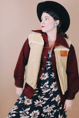 Men's vintage 1980's Swingster, World of Wearables, Made in USA label size medium sleeveless tan suede vest with a cream shearling liner and brass zipper up the front.