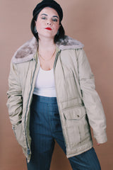 Women's or men's vintage 1980's Tempco Down Insulated, By Tempo Quilters, Seattle, Made in the USA label size large tan colored zip up puffer jacket with grey faux fur trim collar.