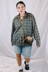 Men's or women's vintage 1970's JCPenney label long sleeve button up shirt with dagger collar in a polyester material. Brown color with all over blue print.