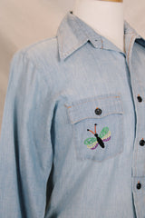 Men's or women's vintage 1970's JCPenney label long sleeve light blue chambray denim shirt with all over colored embroidery.