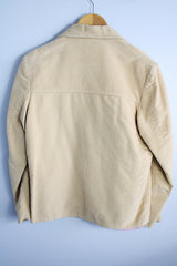 Women's vintage 1960's Union Made, Genuine Heeksuede Made in Holland label long sleeve short length tan colored suede button up lightweight jacket. Two front pockets and pink liner.