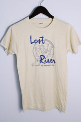 Men's or women's vintage 1980's Screen Stars, Made in USA label short sleeve light tan colored tee with blue graphic on the front in a cotton and polyester material.