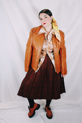 Men's or women's vintage 1970's The Leather Shop, Sears The Men's Store label long sleeve short length camel brown colored leather zip up jacket.