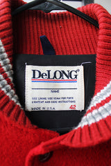 Men's or women's vintage 1980's DeLong, Made in USA label long sleeve dark red and grey varsity letterman jacket with patches and pins. Wool and leather material.
