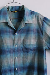 Men's or women's vintage 1960's Sears label long sleeve button plaid shirt in blue and grey colors. One left chest pocket.