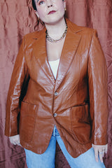 Women's or men's vintage 1970's Cresco label camel brown colored leather blazer jacket with two button closure and two front pockets.