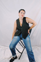 Men's or women's vintage 1970's sleeveless chocolate brown waistcoat vest in a wool and rayon mix material. Tortoise buttons and front pockets.