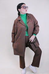 Women's vintage 1970's lightweight brown colored pea coat with a double breasted closure. Brown buttons and white contrast stitching