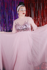 Women's vintage 1980's long sleeve long length pink maxi dress. Has sheer sleeves and sequins across the chest