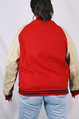 Men's vintage 1987 Nelson's Jackets, Portland, Oregon label long sleeve cream and red colored varsity letterman jacket in wool and nylon material. Has patches and pins.