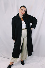 Women's vintage 1990's Nordstrom - Point of View label long sleeve long length black trench coat in a wool material. Fully lined, side pockets, back slit, and shoulder pads.