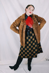 Men's or women's vintage 1970's long sleeve light brown tan colored suede jacket. Has silver snap buttons, contrast stitching, and a dagger collar.