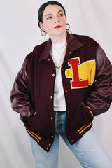 Men's or women's vintage 1980's Settlemien's label long sleeve maroon varsity letterman jacket with a yellow patch and trim.