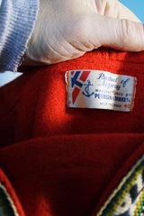 Women's vintage 1960's Product of Norway, Manufactured by Petersen & Dekke label Norwegian style pullover sweater in red wool with decorative trim and metal clasp closures