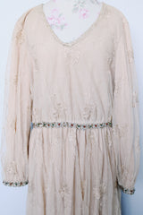 Women's vintage 1960's ankle length cream dress with lace overlay that has gold metallic detail. Beaded belt and beaded cuffs.