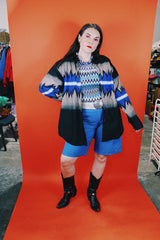 Men's vintage 1980's Express Rider label long sleeve button up shirt with a black, blue, and beige Western style print.