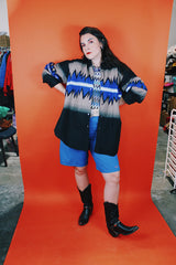 Men's vintage 1980's Express Rider label long sleeve button up shirt with a black, blue, and beige Western style print.