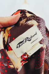 Men's vintage 1980's Tori Richard Honolulu, Made in USA label brown polyester button up shirt with all over floral print.
