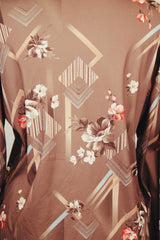 Men's vintage 1970's Montgomery Ward label long sleeve light brown colored button up shirt with all over floral print.