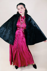 Women's vintage possibly 1940's black colored pony fur large cape poncho with fur trim around the edges. Has a closure at the neck and the peter pan collar and fully lined.