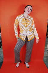 Women's vintage 1970's long sleeve button up blouse with dagger collar, darted bust, and big round clear buttons.