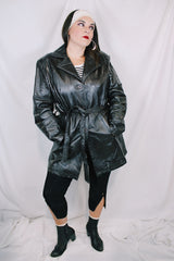 Women's vintage 1980's Leather King label long sleeve dark chocolate brown long length leather coat with button front closure and matching tie belt.