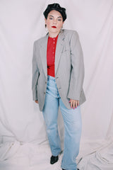 Men's or women's vintage 1970's Designed by Oleg Cassini label long sleeve light grey colored blazer with button closure and front pockets.