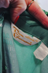 Men's vintage 1970's Don Giovanni California label long sleeve green colored button up shirt with all over floral print in a thick polyester material.