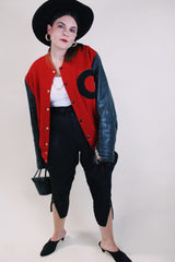 Men's or women's vintage 1970's De Long Sportswear Classics label long sleeve letterman bomber jacket with red wool body and black leather arms.