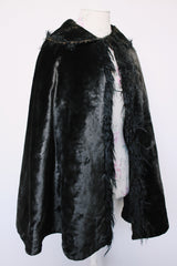 Women's vintage possibly 1940's black colored pony fur large cape poncho with fur trim around the edges. Has a closure at the neck and the peter pan collar and fully lined.