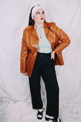 Men's or women's vintage 1970's Grodins label long sleeve tan light brown buttery leather jacket with button closure. Western style.