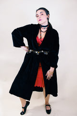 Women's vintage 1960's ankle length long sleeve black velvet duster jacket. Fully lined and has two side pockets.