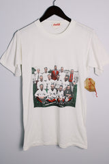 Women's or men's vintage 1986 Coca-Cola label short sleeve white tee with graphic on the front in a polyester and cotton material.