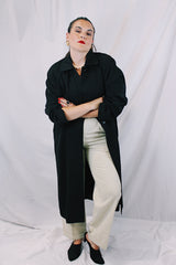 Women's vintage 1990's Nordstrom - Point of View label long sleeve long length black trench coat in a wool material. Fully lined, side pockets, back slit, and shoulder pads.