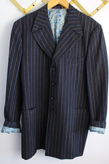Men's or women's vintage 1970's University Seal Authentic Fashion label long sleeve navy blue wool blazer with all over pin stripes. Has pockets, textured buttons, and a back slit.
